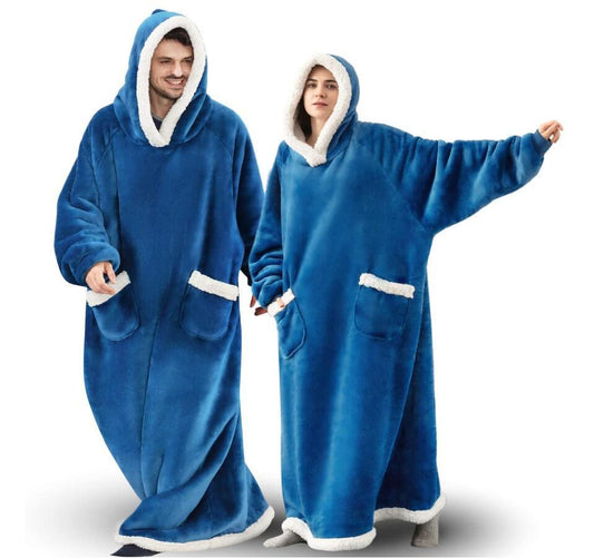 Woman and man wearing blue extra long hoodie blankets that cover from head to toe.