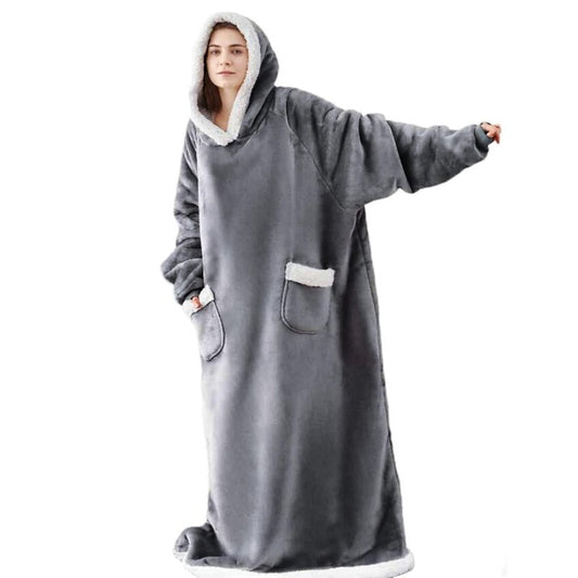 Woman wearing a grey long snuggle hoodie.