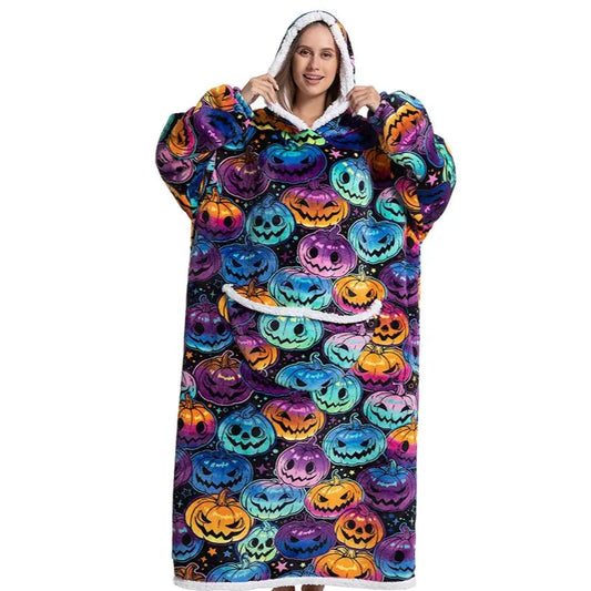 Happy person wearing a long snuggle hoodie with halloween-themed pumpkin pattern.