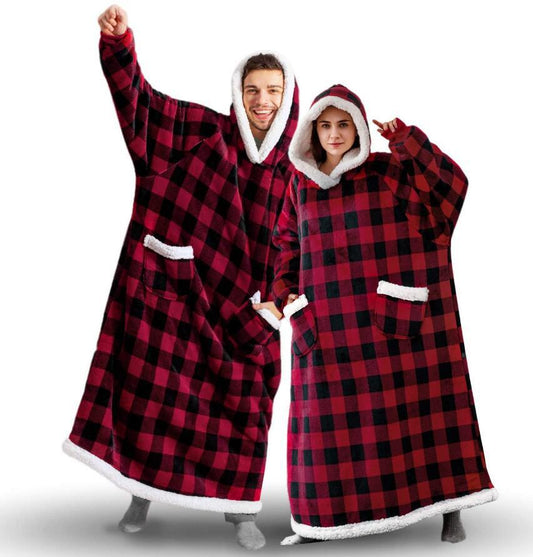 Woman and man wearing red and black extra long hoodie blankets that cover from head to toe.