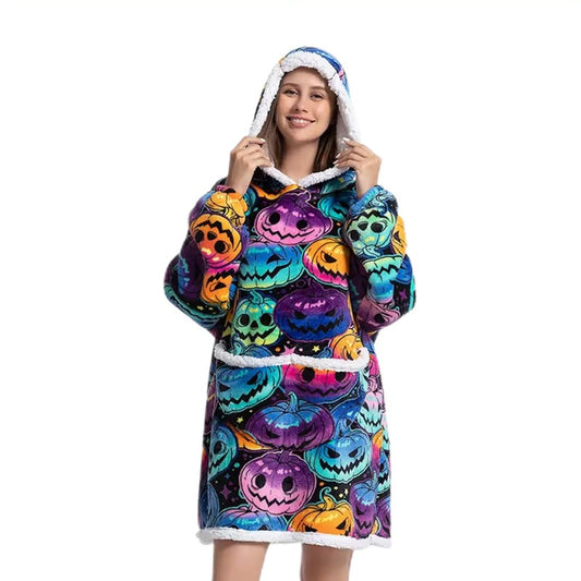 Happy woman in a sherpa blanket hoodie with Halloween pattern.