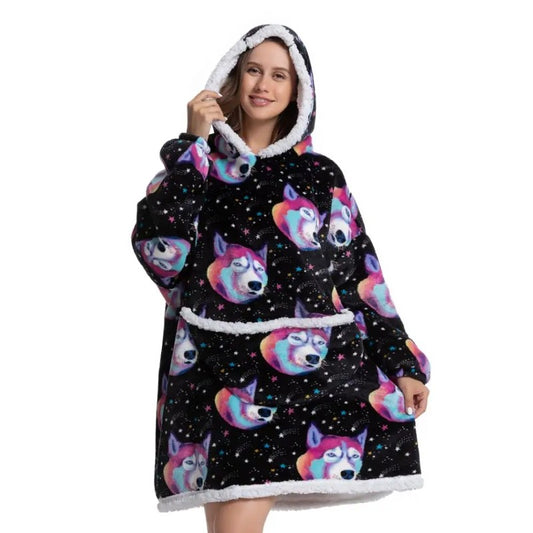 Woman in oversized blanket hoodie with a funny dog pattern.