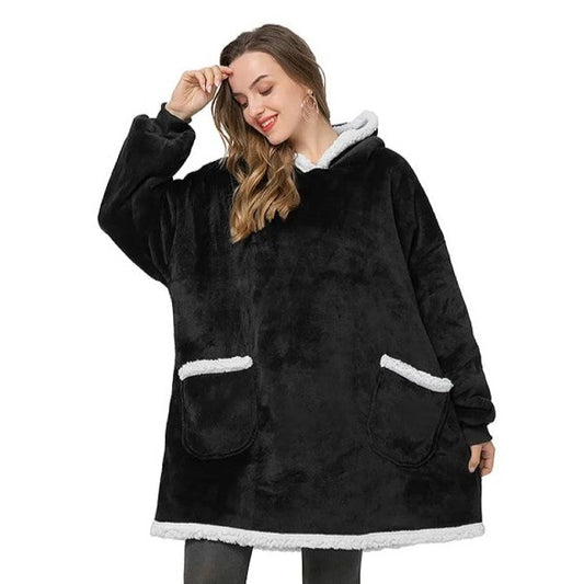 Person in cozy black sherpa blanket hoodie with two pockets.