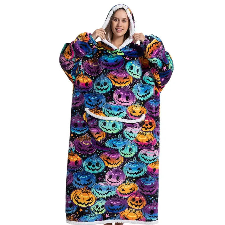 Happy person wearing a long snuggle hoodie with halloween-themed pumpkin pattern. 