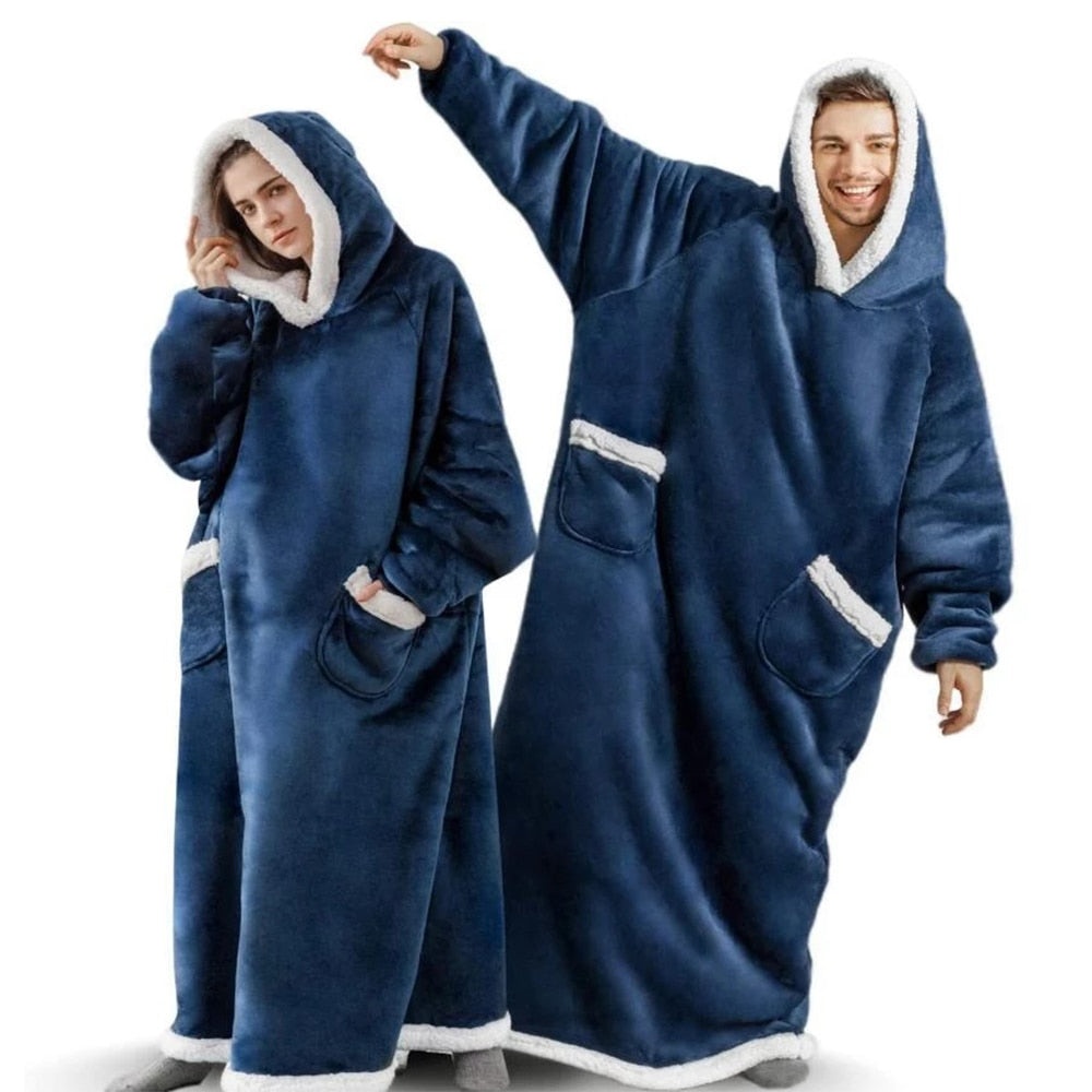 Woman and man wearing navy blue extra long blanket hoodie that cover from head to toe. 